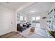 Gathering room with sliding glass doors and built-in shelving at 45032 Sunflower Ln, Bennett, CO 80102