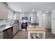 Modern kitchen with stainless steel appliances and granite countertops at 45032 Sunflower Ln, Bennett, CO 80102