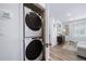 Stackable washer and dryer in a convenient laundry room at 45032 Sunflower Ln, Bennett, CO 80102