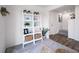 Stylish white shelving unit in the living area at 45032 Sunflower Ln, Bennett, CO 80102