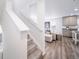 Modern kitchen and staircase view at 45032 Sunflower Ln, Bennett, CO 80102