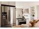 Modern kitchen featuring stainless steel appliances, a gas range, and stylish finishes at 5700 E Floyd Ave, Denver, CO 80222