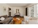 Bright living room with hardwood floors, stylish seating, and decor at 5700 E Floyd Ave, Denver, CO 80222
