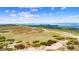 Expansive lot with rolling hills and mountain views in a serene, countryside setting at 1232 Berganot Trl, Castle Pines, CO 80108