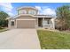 Charming two-story home with a two-car garage and inviting front porch at 1232 Berganot Trl, Castle Pines, CO 80108