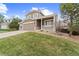 Charming two-story home showcasing a well-maintained lawn, complemented by an attached garage and a cozy front porch at 1232 Berganot Trl, Castle Pines, CO 80108