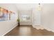 Elegant living room showcases hardwood floors, neutral walls, and ample natural light at 1232 Berganot Trl, Castle Pines, CO 80108