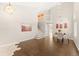 Open living area with staircase, modern lighting, and dining area adjacent at 1232 Berganot Trl, Castle Pines, CO 80108