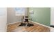 Charming home office with hardwood floors, a large window, and neutral paint creates a serene workspace at 1232 Berganot Trl, Castle Pines, CO 80108