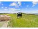 Entrance to Daniels Park with stone boulders, a sign, and views of the surrounding grassy landscape under a clear blue sky at 1232 Berganot Trl, Castle Pines, CO 80108