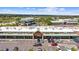 Storefront featuring a variety of businesses, with ample parking and well-maintained landscaping in a vibrant commercial area at 1232 Berganot Trl, Castle Pines, CO 80108
