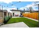 Backyard with artificial turf and string lights is perfect for outdoor entertainment and relaxation at 1402 Meade St, Denver, CO 80204