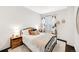 Cozy bedroom features a plush bed, floral curtains, and wood nightstand at 1402 Meade St, Denver, CO 80204