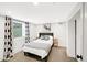 Cozy bedroom featuring neutral decor, a comfortable bed, and a window with stylish curtains at 1402 Meade St, Denver, CO 80204