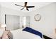 Airy bedroom showcasing white walls, a ceiling fan, a closet, and stylish decor at 1402 Meade St, Denver, CO 80204