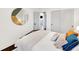 Bedroom with large bed, sliding closet doors, and modern decor at 1402 Meade St, Denver, CO 80204