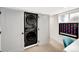 Laundry closet with a stacked washer and dryer and a fun game to make laundry more enjoyable at 1402 Meade St, Denver, CO 80204