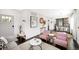 Cozy living room with pink armchairs, modern decor, and open layout at 1402 Meade St, Denver, CO 80204