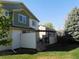 Expansive backyard with a pergola-covered patio and well-manicured lawn, ideal for outdoor activities at 14642 Williams St, Thornton, CO 80602