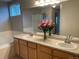 Bathroom features a double sink vanity and a separate shower and bathtub at 14642 Williams St, Thornton, CO 80602