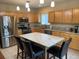 Modern kitchen with stainless steel appliances, granite countertops, and a convenient center island with seating at 14642 Williams St, Thornton, CO 80602