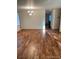 Bright and open living room with gleaming hardwood floors, offering a spacious and inviting atmosphere at 14642 Williams St, Thornton, CO 80602