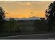 Stunning mountain view at sunset, showcasing the natural beauty and open space surrounding the neighborhood at 14642 Williams St, Thornton, CO 80602