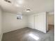 Basement featuring carpet flooring, a small window, and closet at 3268 S Patton Ct, Denver, CO 80236