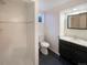 Bathroom featuring a walk-in shower and modern vanity at 3268 S Patton Ct, Denver, CO 80236