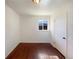 Bedroom with hardwood floors and a window offering natural light at 3268 S Patton Ct, Denver, CO 80236