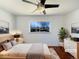 Serene main bedroom featuring hardwood floors, neutral decor, and a bright window at 3268 S Patton Ct, Denver, CO 80236