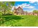 Spacious backyard with a large lawn, perfect for outdoor activities and gatherings at 3520 Newton St, Denver, CO 80211