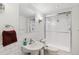 Bright bathroom featuring white subway tile, a glass-enclosed shower, and modern fixtures at 3520 Newton St, Denver, CO 80211