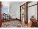 Bedroom with wood floors and doors and a colorful rug at 3520 Newton St, Denver, CO 80211