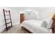 Cozy bedroom featuring neutral paint, soft carpet, a queen bed, and modern light fixtures at 3520 Newton St, Denver, CO 80211