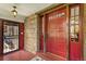 Covered front porch with decorative doors and stone accents at 3520 Newton St, Denver, CO 80211