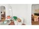 Cozy sitting area with white chairs and stylish decor, flooded with natural light at 3520 Newton St, Denver, CO 80211