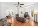 Spacious living room with hardwood floors and open layout to dining area at 3520 Newton St, Denver, CO 80211