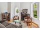 Elegant living room with a fireplace, hardwood floors, and stylish furniture at 3520 Newton St, Denver, CO 80211