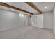 Unfinished basement space with exposed beams and storage options at 2290 E Columbia Pl, Denver, CO 80210