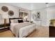 Relaxing bedroom featuring hardwood floors, soft lighting, and a window for natural light at 2290 E Columbia Pl, Denver, CO 80210