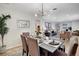 Open concept dining and living area featuring a modern chandelier and tastefully decorated furniture at 2290 E Columbia Pl, Denver, CO 80210
