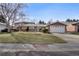 Inviting single Gathering home with well-manicured lawn and attached two car garage at 2290 E Columbia Pl, Denver, CO 80210