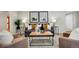 Tastefully decorated living room with a wooden coffee table, accent chairs, and modern lamps at 2290 E Columbia Pl, Denver, CO 80210