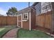 Charming backyard storage shed with flower box adding to the appeal of the outdoor space at 2290 E Columbia Pl, Denver, CO 80210