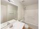 Well-lit bathroom featuring a tub-shower combination and vanity with sink at 4670 Quandary Peak St, Brighton, CO 80601