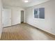 Bedroom featuring wood floors, white walls, and a closet providing storage space at 4670 Quandary Peak St, Brighton, CO 80601
