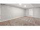 Finished basement offering ample space and featuring new carpeting, modern lighting, and neutral colors at 118 S Yates Way, Denver, CO 80219