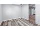 This bedroom features plank floors, a large window, and neutral walls that create a cozy and inviting space at 118 S Yates Way, Denver, CO 80219