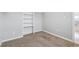 Bedroom with a window and a built in shelving unit at 118 S Yates Way, Denver, CO 80219